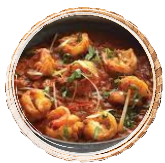 Shrimps simmered with ghee/ mustard oil, plenty of tomatoes, coarsely crushed roasted spices garnished with julienned ginger and coriander.