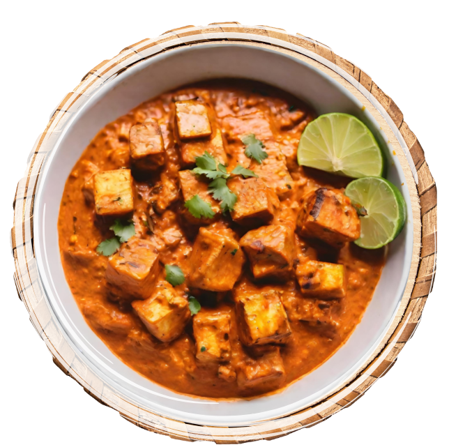 Marinated Indian cheese cubes are grilled and then simmered in a rich, spiced tomato-based curry.