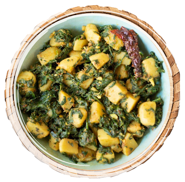 Flavorful vegetarian curry of potatoes and spinach cooked with mixed spices.